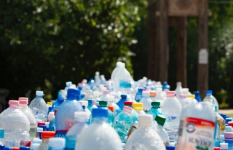 Large quantity of plastic bottles outdoors, ready for sorting and recycling